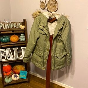Green hooded jacket. Lightly lined.